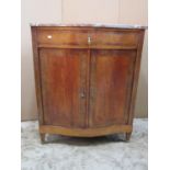 A rosewood and satinwood veneered serpentine front side cabinet with crossbanded detail, enclosed by