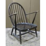 A vintage Ercol dark stained beechwood hoop and stick back open armchair with sprung seat (af)