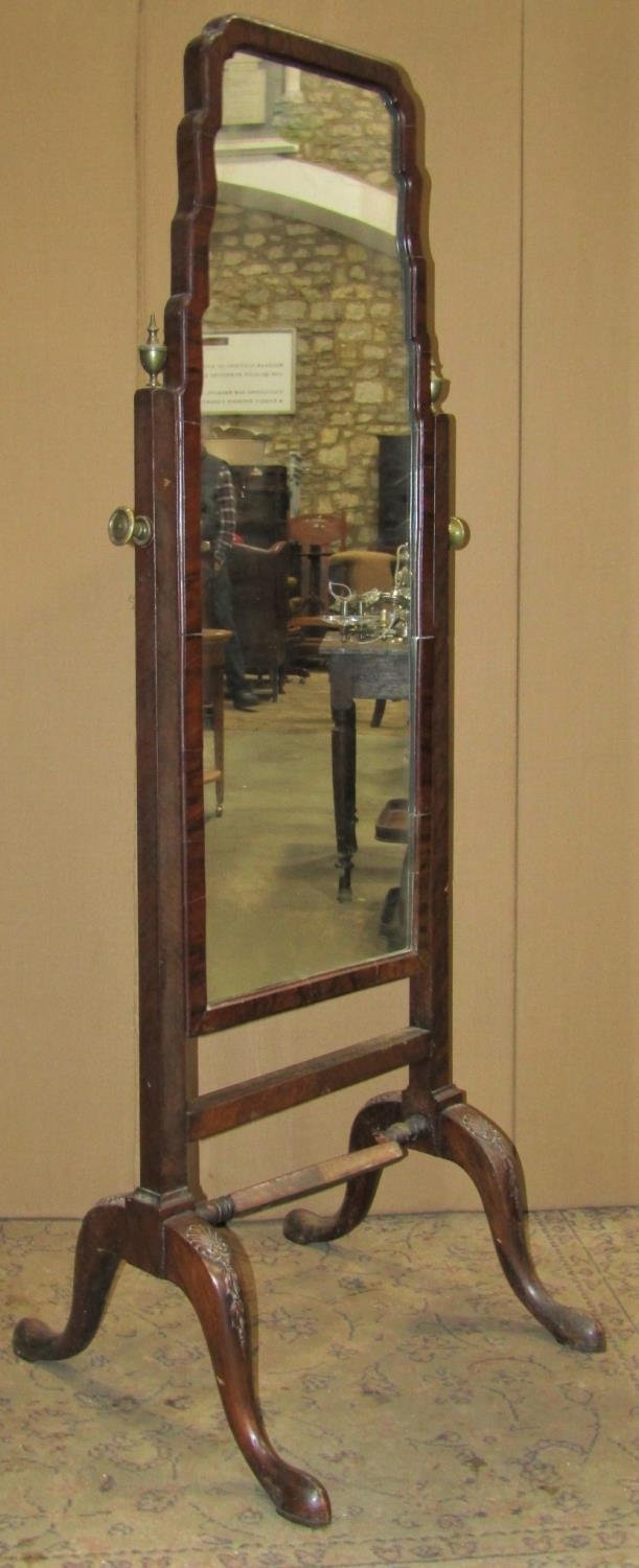 An Edwardian Queen Ann style cheval mirror raised on swept supports, 158 cm high