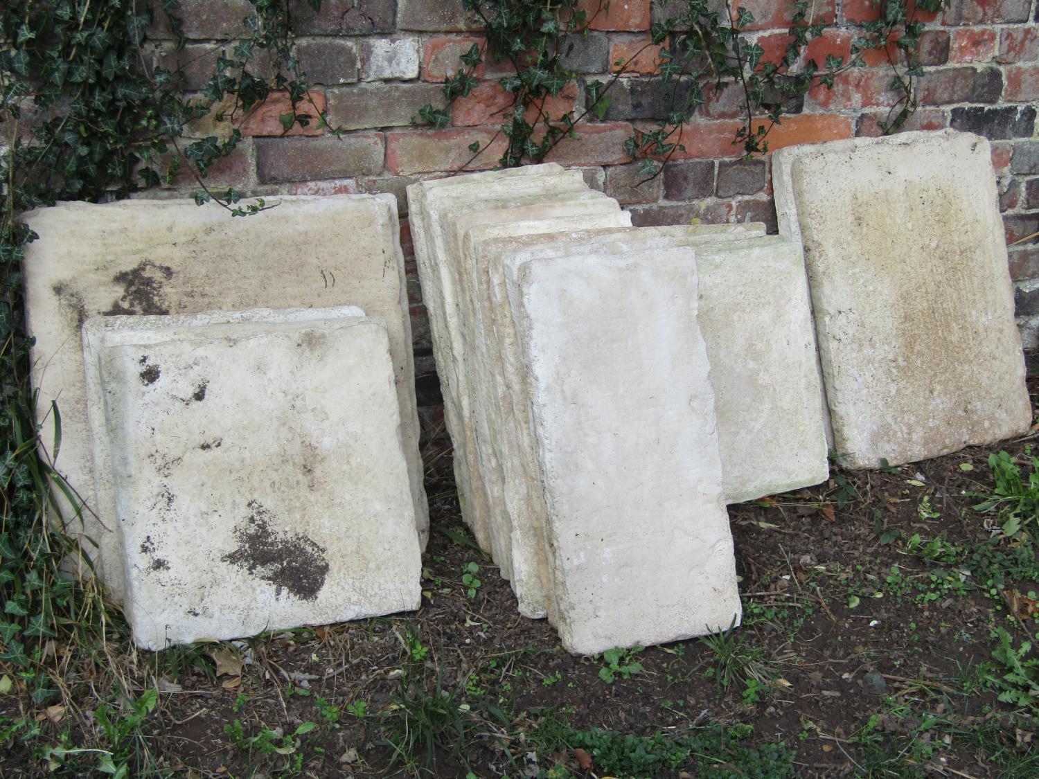 21 composition stone paving slabs, varying size, largest examples 60 cm square