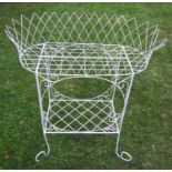 A Victorian style lattice wirework two tier garden/conservatory planter raised on simple scrolled