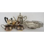 A selection of silver plated items including a meat cover, a circular tray, tea and coffee pots,