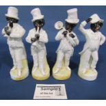 A set of four American musicians, Staffordshire figure of Uncle Tom, a further Staffordshire