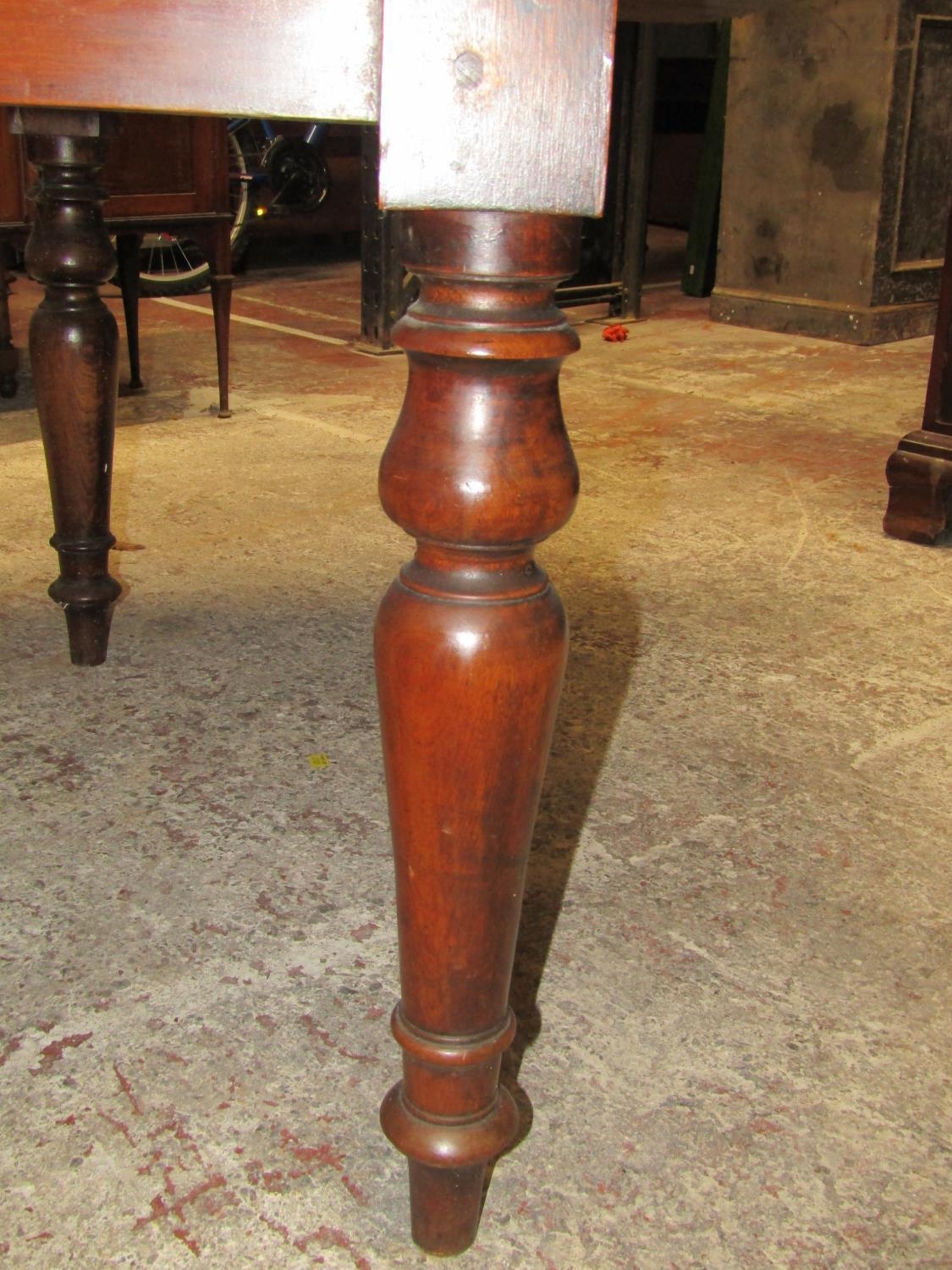 A 19th century mahogany drop leaf dining table on four turned supports, the top with swivel action - Image 5 of 6