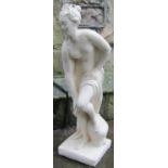 A composition stone garden ornament in the form of a classical maiden set on a square platform base,