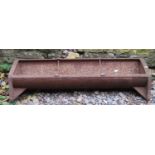 A vintage cast iron pig feeding trough of rectangular form with two simple rung divisions 96 cm long