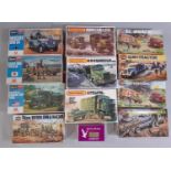 12 model kits of military and emergency rescue vehicles including kits by Airfix, Hasegawa, Matchbox