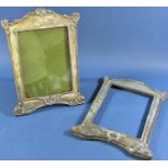 A pair of silver photo frames, 1 complete with back, stand and glass, the other without, hallmarks