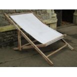 A large outsized traditional folding deck chair, 104 cm wide