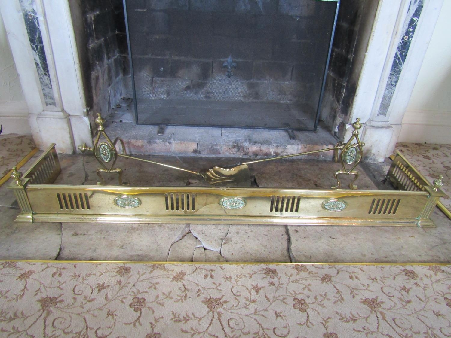 To be viewed at and collected from Nibley House GL11 6DL:A Victorian brass fire curb, two fire