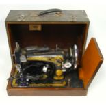 Singer electric sewing machine, cased.