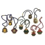 A collection of member's badges for the Royal Hong Kong Jockey Club, in gilt-metal & enamel to