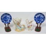 Pair of Regency Wedgwood earthenware saucers, each with a blue and white river scene with boats