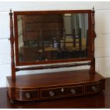George IV inlaid mahogany breakfront toilet mirror with a rectangular plate and three drawers on