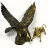Heavy brassed cast iron model of an eagle perched on a rocky base, H 62.5cm and a heavy cast solid