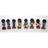 Robertsons earthenware 8 piece Golly band painted in bright colours, H 7.5cm (the tallest)