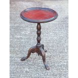Good Edwardian mahogany finish carved beech table with a beaded circular tray top, on floral and