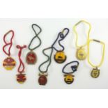 A collection of member's badges for the Royal Hong Kong Jockey Club, in gilt-metal & enamel to