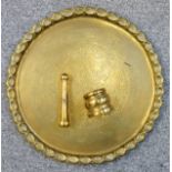 Indian brass circular tray with indented pie crust rim and central reserve of foliate decoration