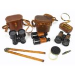 Pair of Dollond binoculars with sun shields, pair of similar War Office binoculars, cased, pair of