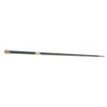 Edwardian conductor's ebonised wood baton, with a sroll engraved silver pommel, collar and ferule,