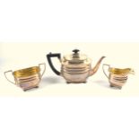 George V silver 3 piece tea set comprising a rounded rectangular teapot with moulded bands and