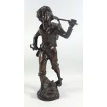 Late 19th century Continental bronze figure of a labourer carrying a basket of grapes upon his