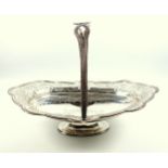 Victorian silver fruit basket of oval form, chased and embossed scrolling foliate decoration,
