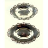 A pair of Edwardian silver oval dishes, pierced scrolling foliate border, by Walker & Hall,