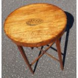 An Edwardian satinwood kingwood cross banded oval sewing table, the hinged top with conche shell