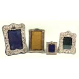 Silver shaped rectangular photograph frame with embossed bird, scroll and lattice decoration, 21 x