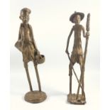 Two Oriental bronze figures of farmers, one with an axe and 2 vessels, standing on a circular