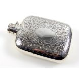 Late Victorian silver spirit flask with all-over engraved floral decoration, lion?s head crest and