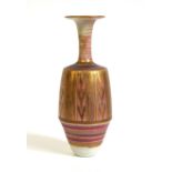 A Mary Rich studio pottery porcelain vase, the flared rim on a slender tapering neck above an
