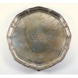 Silver presentation shaped circular salver with a reeded and floral piecrust rim and inscription ?