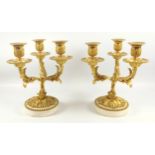 A pair of 19th century ormolu and white marble 3 branch candelabra, the foliate scrolling arms and