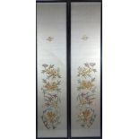 20th Century Chinese School - A pair of embroidered panels depicting figures amongst foliage, 89cm x