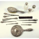 Three piece silver dressing table set comprising a hand mirror, hair brush and comb, by Broadway &