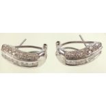 Pair of white metal half hoop earrings encrusted with diamonds, stamped ?18K, 750?, 7grs
