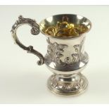 Victorian silver Christening mug of campana form, with embossed leaf and scroll decoration,