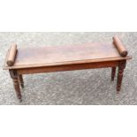 A Victorian oak window seat with turned arm rests, on turned legs, 114 cm wide