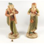 A pair of late 19th century Hadley's Worcester Faience hand painted figures, male and female