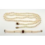 Freshwater pearl necklace with 114 7mm uniform beads with a 9ct gold clasp set garnet and 7 half