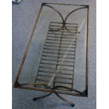 Contemporary bronzed metal rectangular coffee table with a bevelled glass top and undertier, on 4
