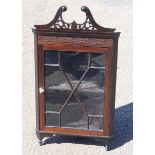 19th century mahogany hanging corner cupboard, the later swan neck pediment over a blind fret