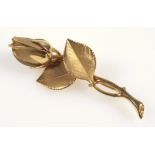 Yellow metal single rose brooch by H S B, stamped 14KT, L 5.4cm. 7.2grs