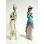 Lladro porcelain figure ?Walk with the Dog? of an elegant lady cradling a dog in her left arm,