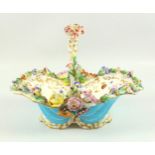 A 19th century Coalbrookdale porcelain basket encrusted and decorated with flowers highlighted in
