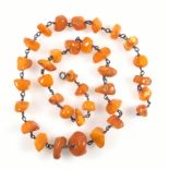 Amber necklace with 35 baroque beads and bolt ring clasp, L 71.5cm, 68.6grs