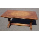A 20th century oak dining suite comprising a table and 5 chairs, the table with rectangular top on a